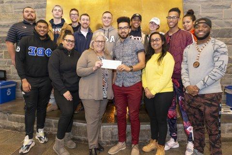 InterGreek Council check presentation